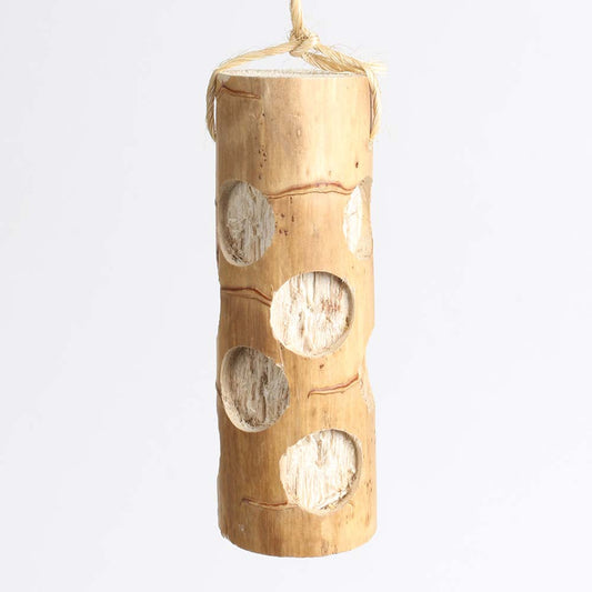Wooden bird feeder with circular holes on a white background