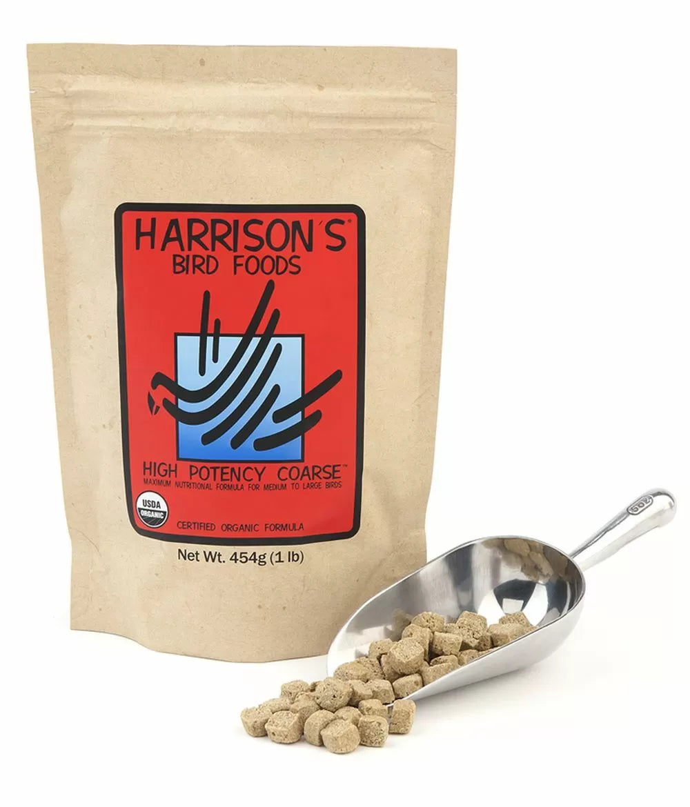 A package of Harrison's High Potency Coarse Bird Food next to a spoonful of the powdered bird food, with a red label on the package and a blue patterned spoon.