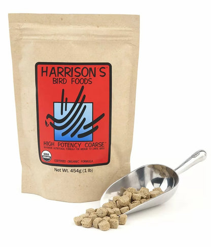A package of Harrison's High Potency Coarse Bird Food next to a spoonful of the powdered bird food, with a red label on the package and a blue patterned spoon.